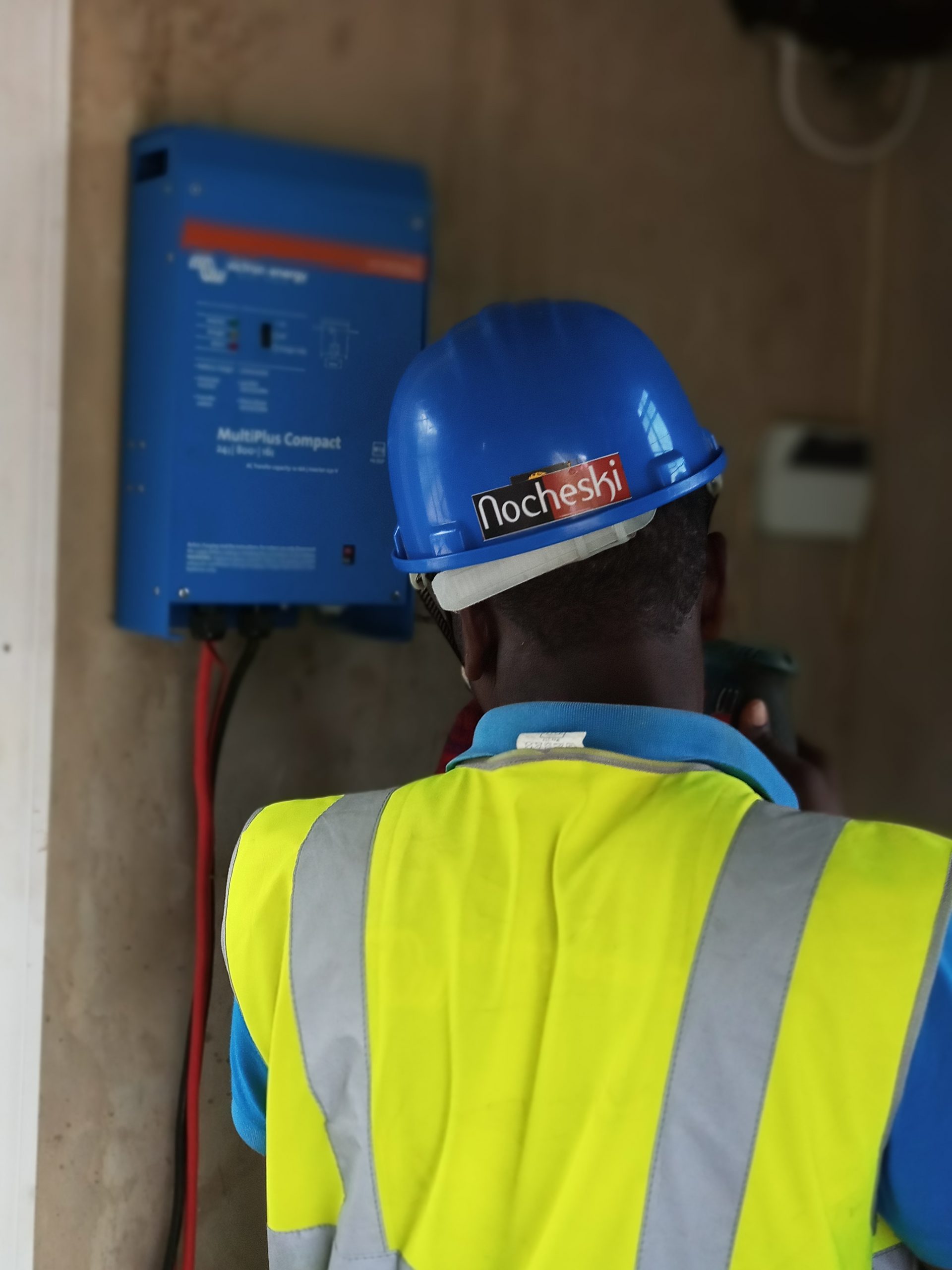 Nocheski Solar engineer inspecting a professional solar installation in Ghana